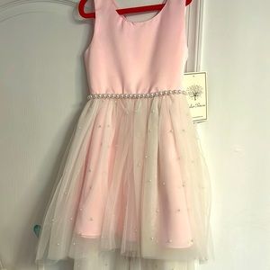 Tulle pink dress.  Tulle with pearl like buttons